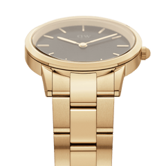 Close-up of Iconic Link Gold women’s watch with black dial and gold-plated stainless steel link bracelet by Daniel Wellington.