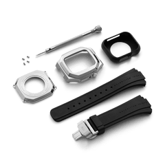 Daniel Wellington Switch Silver Apple Watch case kit featuring a brushed stainless steel geometric case, black rubber strap with deployment clasp, back plate, screws, screwdriver, and protective insert.