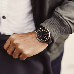 Classic Reading Black Rose Gold watch worn on the wrist, styled with a white shirt and dark jacket for a smart, understated look.