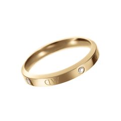 Classic Lumine Ring in gold with slim band, sparkling crystals and engraved DW logo, elegant women’s accessory.