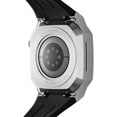 Close-up of the back of the Daniel Wellington Switch Silver Apple Watch case, showing the brushed stainless steel finish, engraved details, and integrated black rubber strap.