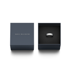 Emalie Ring Silver presented in an elegant Daniel Wellington gift box, showcasing its polished silver band with a satin white enamel inlay.