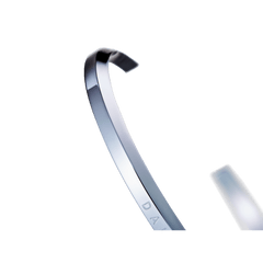 Close-up of the Classic Bracelet Silver highlighting its polished stainless steel finish, slim open cuff design, and subtle engraved detailing.