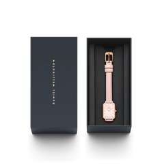 Quadro Pressed Rouge women’s watch with a rectangular rose gold case and nude pink croc-pattern leather strap, presented in an elegant Daniel Wellington gift box.