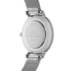 Back view of Petite Sterling women’s watch showing engraved stainless steel case and silver mesh strap by Daniel Wellington.