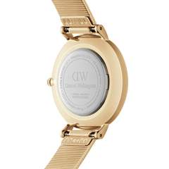 Back view of Petite Lumine Pressed Piano Gold watch showing engraved Daniel Wellington case and gold piano-link strap.