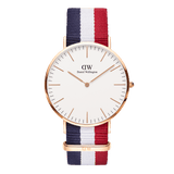 Daniel Wellington Classic Cambridge Rose Gold watch with a slim rose gold case, minimalist white dial, and a blue, white, and red striped NATO strap.
