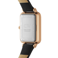 Close-up of the Quadro Pressed Sheffield Green Rose Gold watch showing the stainless steel case back with engraved details and a black leather strap.