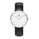 Minimalist silver Daniel Wellington Classic Sheffield watch with white dial and black leather strap, elegant unisex design.