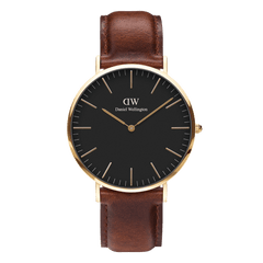Daniel Wellington Classic St Mawes Gold watch with black dial, gold case, and brown leather strap, minimalist design.