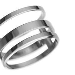 Close-up of the Elan Triad Ring Silver showing its polished stainless steel finish and distinctive three-band contemporary design.