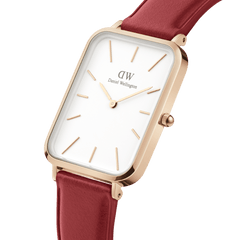 Rectangular rose gold women’s watch with an eggshell white minimalist dial and a cherry blush red pressed leather strap.
