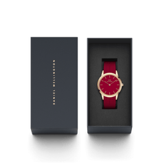 Daniel Wellington Iconic Motion Ruby watch with a rose gold case and red rubber strap, presented in an elegant branded gift box.