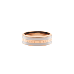 Wide rose gold band ring with a desert sand enamel inlay and Daniel Wellington engraved along the polished edge.
