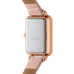 Back view of the Quadro Pressed Rouge watch showing the engraved stainless steel case, rose gold edging, and nude pink croc-pattern leather strap.