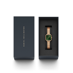 Quadro Studio Emerald Rose Gold watch with an emerald green square dial and rose gold link strap, elegantly presented in a Daniel Wellington gift box.