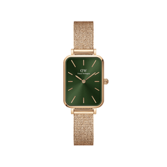 Rose gold Daniel Wellington women’s watch with emerald green square dial and pressed mesh strap, minimalist and elegant design.