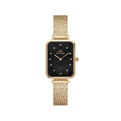 Gold women’s watch with rectangular case, black mother of pearl dial, crystal markers, and pressed piano link strap.