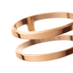 Close-up of the Elan Dual Ring Rose Gold, highlighting its polished dual band design and contemporary rose gold finish.