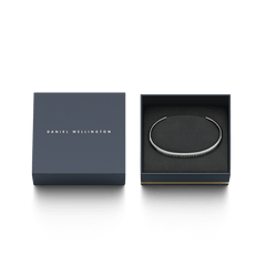 Classic Bracelet Silver presented in an elegant Daniel Wellington gift box, highlighting its polished open cuff design and refined minimalist style.