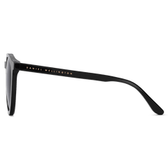 Side view of the Arch Bio-Acetate Black sunglasses showing the slim black bio-acetate arm with gold Daniel Wellington branding.