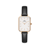 Rectangular Daniel Wellington Quadro Pressed Sheffield watch with an eggshell white dial, rose gold case, minimalist markers, and a black leather strap.