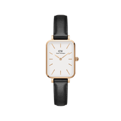 Rectangular Daniel Wellington Quadro Pressed Sheffield watch with an eggshell white dial, rose gold case, minimalist markers, and a black leather strap.