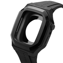 Angular black Daniel Wellington Apple Watch case in stainless steel with a textured FKM rubber strap, shown from a side angle to highlight its modern design and robust construction.