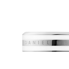 Sleek silver ring featuring a satin white enamel band and the Daniel Wellington logo engraved along the centre.