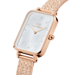 Elegant Quadro Lumine women’s watch in rose gold with a rectangular case, pressed piano link strap, and a white mother of pearl dial set with crystal hour markers.