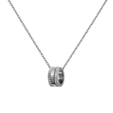Silver necklace featuring a polished geometric ring pendant with engraved detailing, suspended from a delicate cable chain.