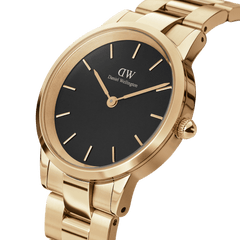 Daniel Wellington Iconic Link Gold women’s watch with black minimalist dial and gold-plated stainless steel link bracelet.