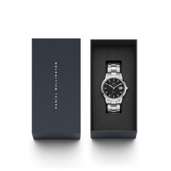Iconic Link Automatic men’s watch with a silver stainless steel bracelet and black dial, presented in an elegant Daniel Wellington gift box.