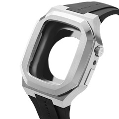 Switch Silver Apple Watch case by Daniel Wellington in brushed stainless steel with a geometric bezel and integrated black rubber strap, shown from an angled side view.