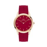 Rose gold Daniel Wellington watch with a bold red dial and matching ruby red rubber strap, featuring minimalist hour markers and a sleek, contemporary design.