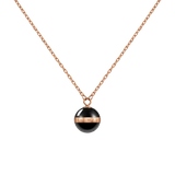 Rose gold necklace featuring a delicate chain and a black ceramic sphere pendant with a polished rose gold plated band engraved with the Daniel Wellington logo.