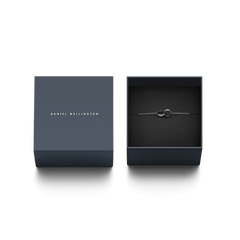 Daniel Wellington Elan Unity Bracelet with interlocking silver rings presented in an elegant navy gift box.