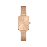 Rose gold women’s watch with a rectangular dial and pressed mesh strap, featuring minimalist hour markers and a polished stainless steel finish.