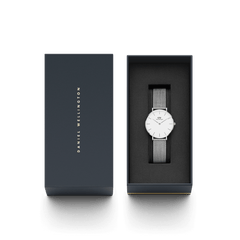 Petite Sterling women’s silver mesh watch with minimalist white dial, elegantly presented in a Daniel Wellington gift box.