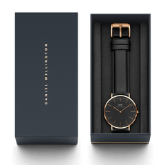 Classic Sheffield Black Rose Gold watch with a black leather strap presented in an elegant Daniel Wellington gift box.