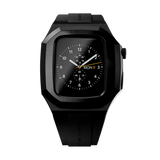 Switch Black Black Daniel Wellington Apple Watch case with a deep black stainless steel frame and black rubber strap, shown fitted to an Apple Watch displaying an analogue watch face.