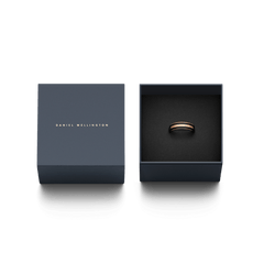 Emalie Ring Rose Gold Black displayed in an open Daniel Wellington gift box, highlighting its polished rose gold band with black enamel inlay.