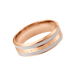 Rose gold band ring with a smooth desert sand enamel inlay and Daniel Wellington engraved along the polished surface.
