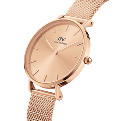 Close-up of the Petite Unitone rose gold women’s watch, showcasing its slim 28mm minimalist dial and elegant mesh strap.
