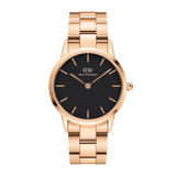 Rose gold Daniel Wellington Iconic Link watch with black minimalist dial and polished stainless steel link bracelet.