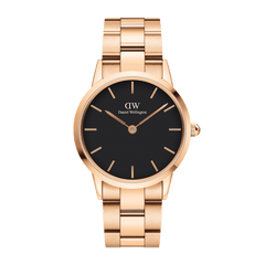 Rose gold Daniel Wellington Iconic Link watch with black minimalist dial and polished stainless steel link bracelet.