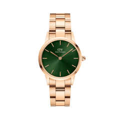 Rose gold watch with a polished link bracelet and a deep emerald green dial featuring minimalist hour markers and hands.
