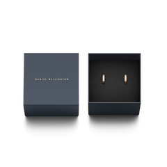 Classic Lumine Rose Gold earrings with crystal detailing, elegantly presented in a navy Daniel Wellington gift box.