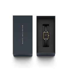 Quadro Pressed Sheffield Black Gold women’s watch with a rectangular black dial and gold case, presented in an elegant Daniel Wellington gift box.