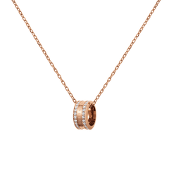 Rose gold necklace featuring a delicate cable chain and a round barrel pendant set with sparkling crystals and engraved detailing.